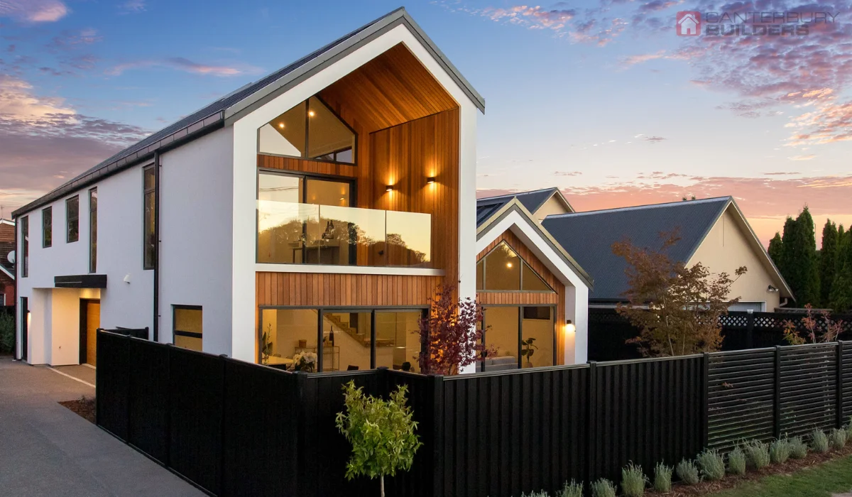 Contemporary double-storey home with timber and glass exterior.